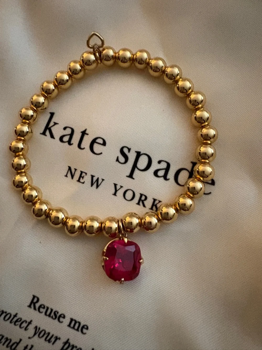 kate spade Gold Beaded Bracelet with Red Gem Charm - Picture 2 of 6